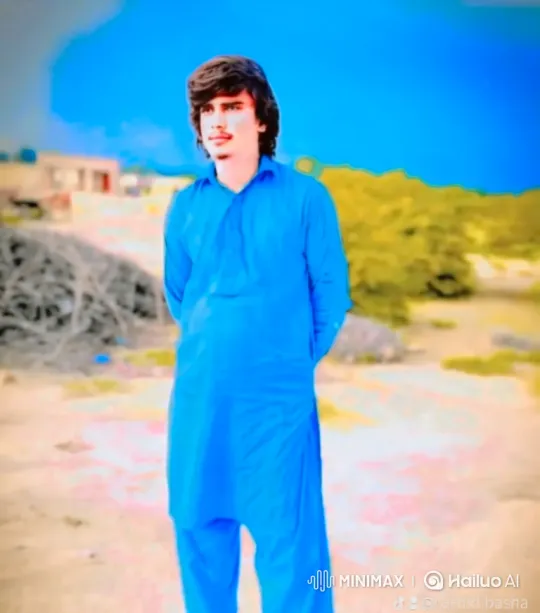 Contemplative Man in Arid Landscape with Blue Attire – AI Generated Video | Hailuo AI