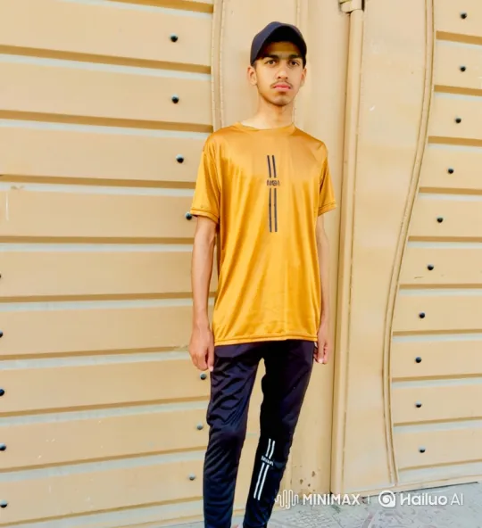 Young Man in Yellow Tee at Gate with Subtle Movements – AI Generated Video | Hailuo AI