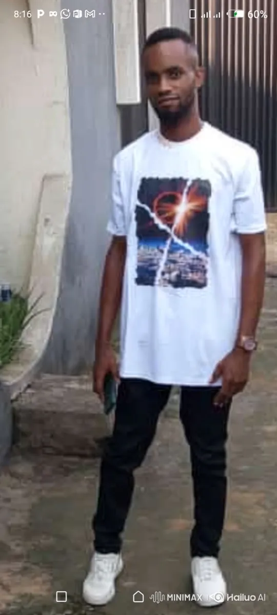 Man in White T-Shirt with Smartphone on Outdoor Paved Surface – AI Generated Video | Hailuo AI