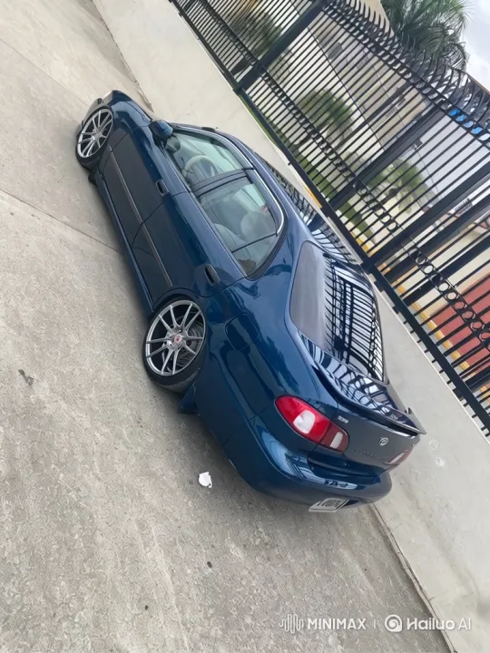 Custom Dark Blue Sedan Showcased in Driveway Setting – AI Generated Video | Hailuo AI