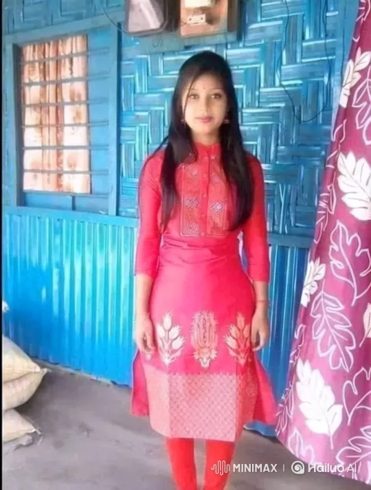 Young Woman in Blue Room with Soft Smile – AI Generated Video | Hailuo AI