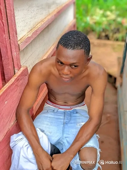 Young Man in Pensive Pose Amidst Outdoor Setting – AI Generated Video | Hailuo AI