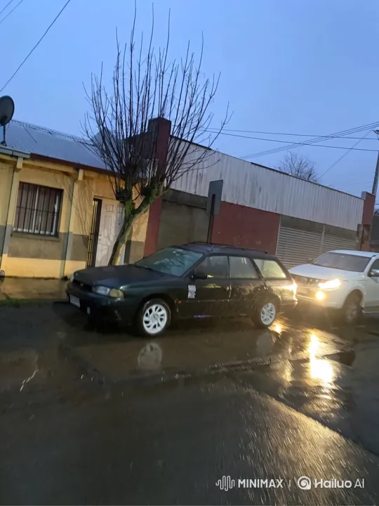Station Wagon Lowers on Wet Street at Dusk – AI Generated Video | Hailuo AI