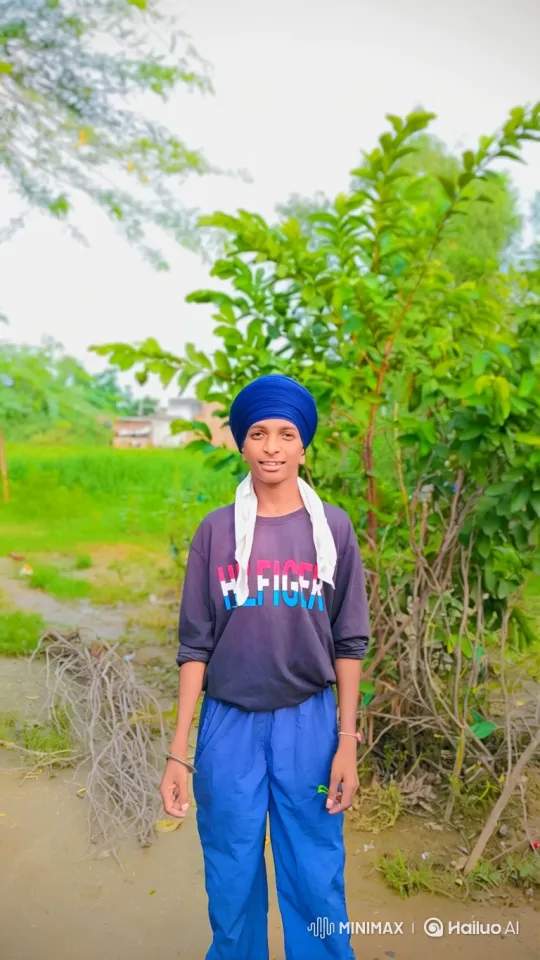Young Person in Turban Smiles Gently in Nature – AI Generated Video | Hailuo AI