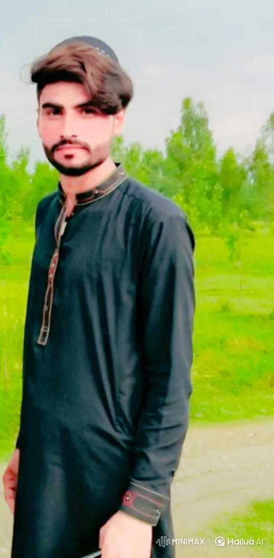 Young Man in Lush Field Amidst Gentle Breeze – AI Generated Video | Hailuo AI