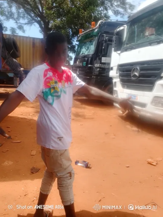 Boy Watches Truck Drive Away in Dusty Landscape – AI Generated Video | Hailuo AI