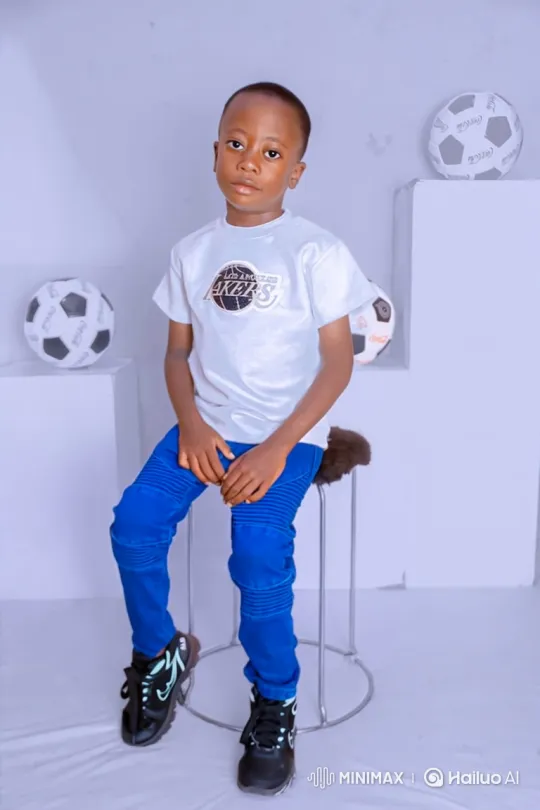 Boy on Stool in Minimalist Studio Setting – AI Generated Video | Hailuo AI