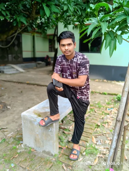 Young Man Poses in Verdant Setting – AI Generated Video | Hailuo AI