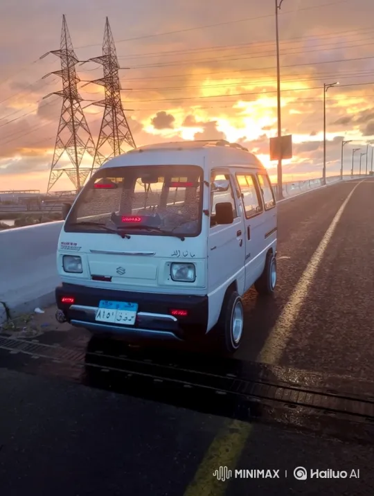 White Microvan Lowers on Sunset Road with Dramatic Sky – AI Generated Video | Hailuo AI