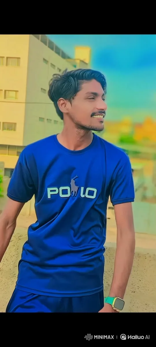 Young Man in Blue Shirt Smiling Outdoors – AI Generated Video | Hailuo AI