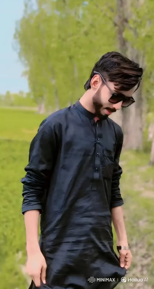 Stylish Man Meditates in Verdant Field – AI Generated Video | Hailuo AI