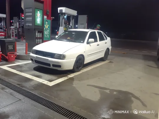 White Sedan Simulates Air Suspension Lowering at Night Gas Station – AI Generated Video | Hailuo AI