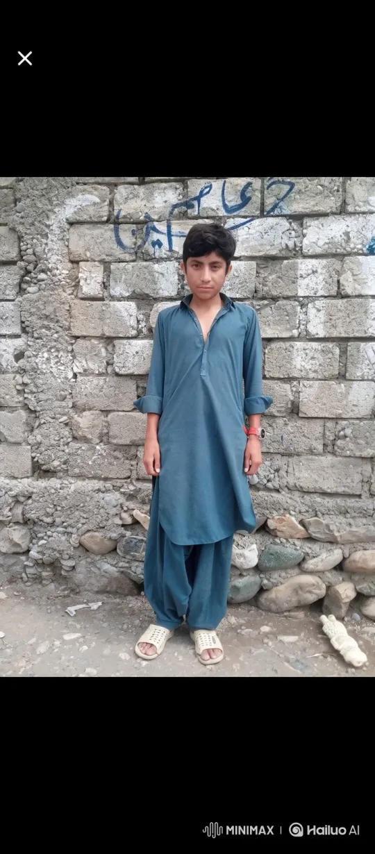 Young Boy Stands Calmly in Front of Weathered Wall – AI Generated Video | Hailuo AI