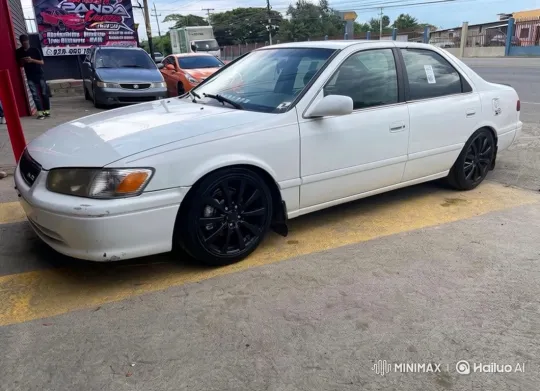 White Sedan Lowering on Custom Black Wheels – AI Generated Video | Hailuo AI