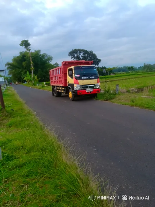 Rural Landscape with Dump Truck on Narrow Road – AI Generated Video | Hailuo AI