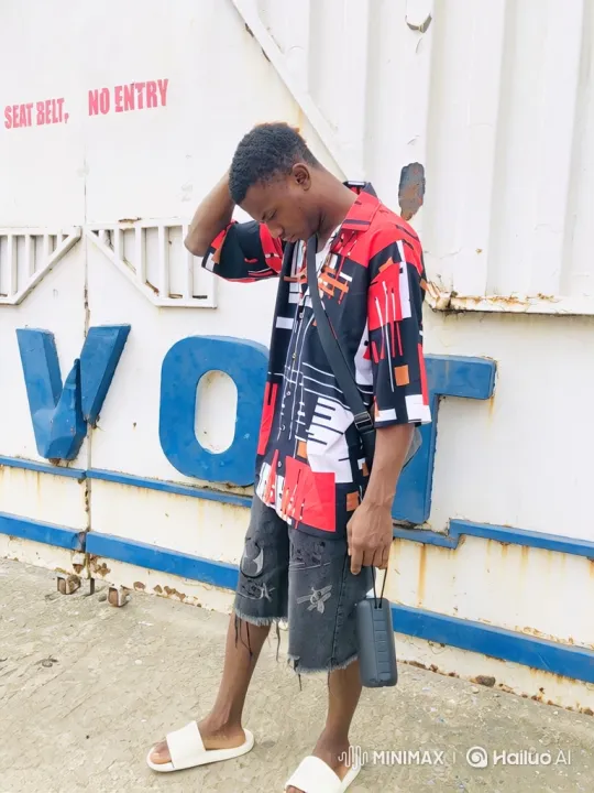 Young Stylish Man Poses with Speaker on Industrial Background – AI Generated Video | Hailuo AI