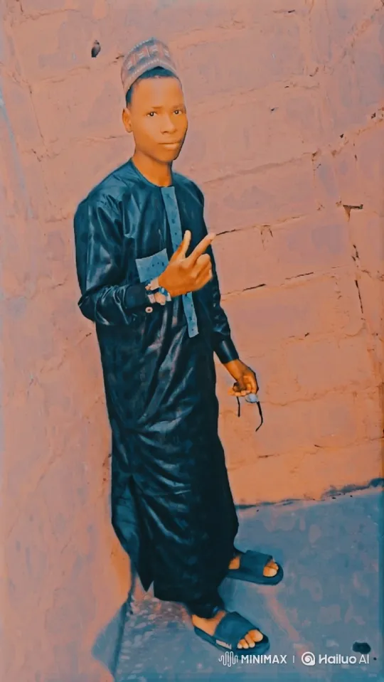 Young Man in Traditional Robe Poses with Poise – AI Generated Video | Hailuo AI