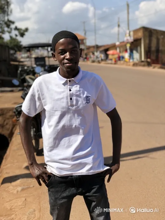 Young Man Watches Car Pass on Quiet Town Street – AI Generated Video | Hailuo AI
