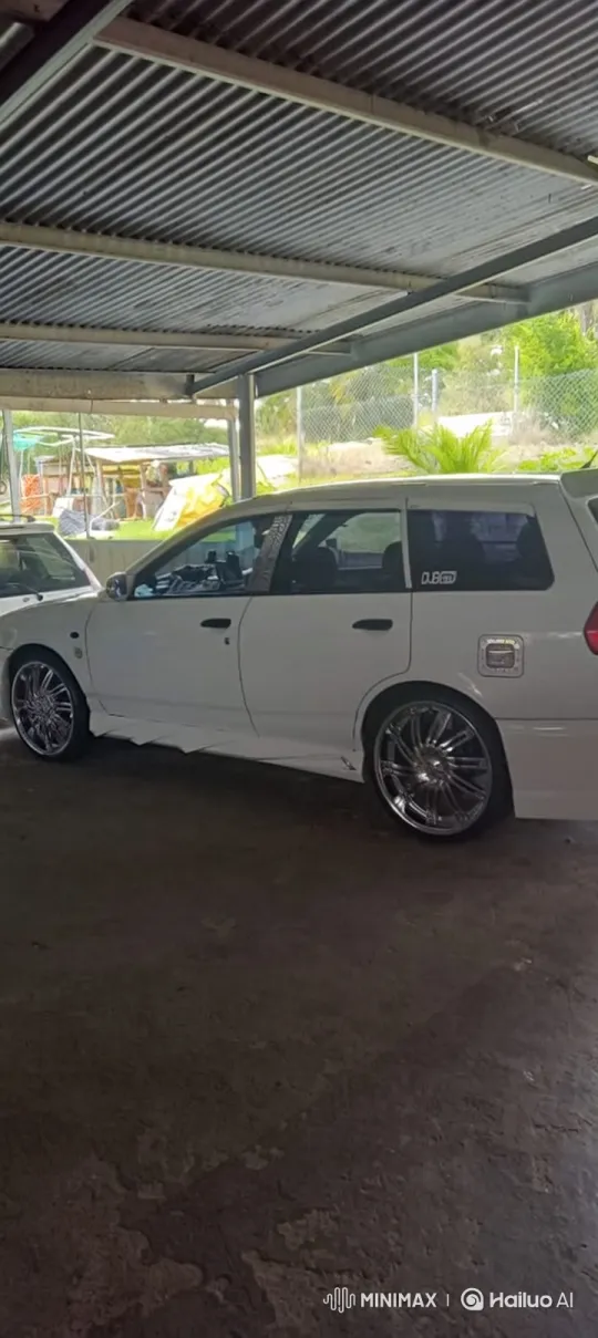 Custom White Station Wagon Lowers in Carport – AI Generated Video | Hailuo AI