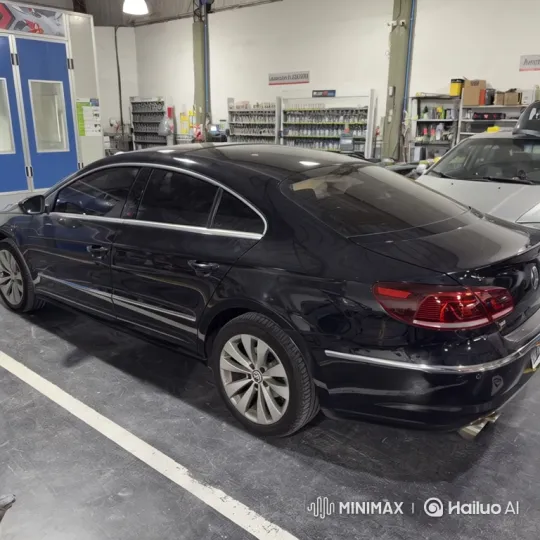 Black Sedan Simulates Air Suspension Lowering in Auto Shop – AI Generated Video | Hailuo AI