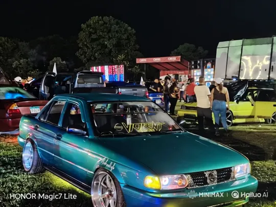 Custom Teal Sedan Lowers on Air Suspension at Car Show – AI Generated Video | Hailuo AI