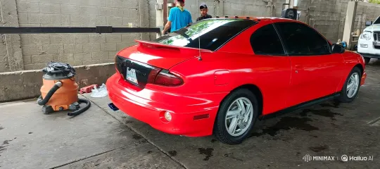 Red Coupe Lowering in Garage with Observers – AI Generated Video | Hailuo AI