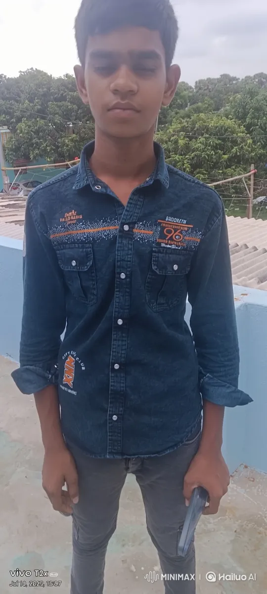 Young Man Contemplates Object on Rooftop in Serene Setting – AI Generated Video | Hailuo AI