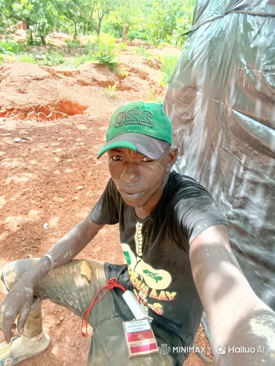 Young Man Takes Selfie Amidst Outdoor Work Area – AI Generated Video | Hailuo AI