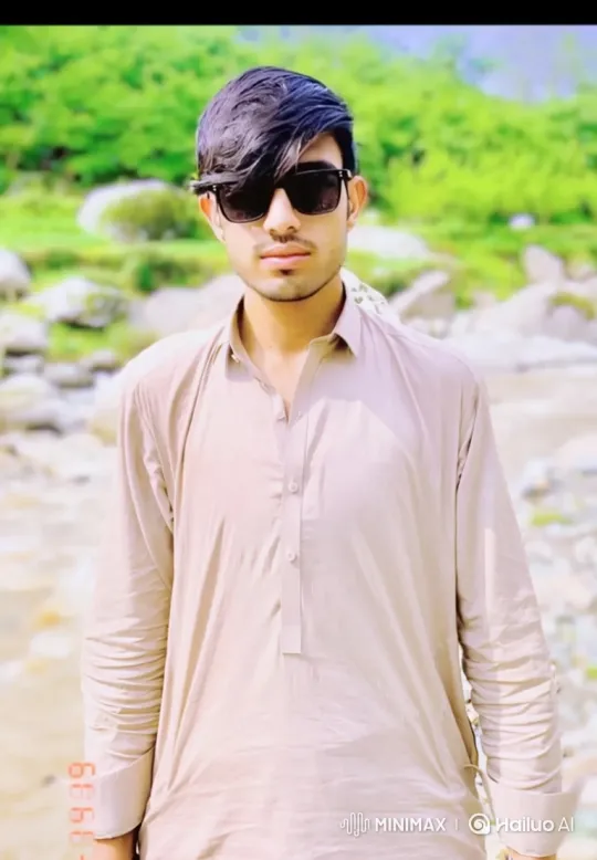 Young Man in Nature with Slow Zoom and Subtle Smile – AI Generated Video | Hailuo AI