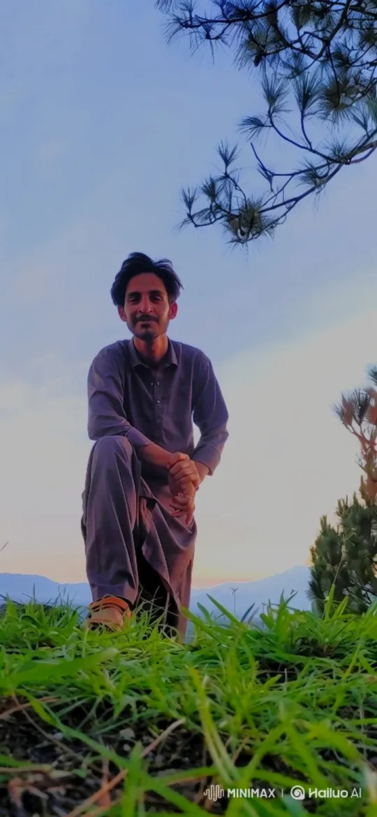 Young Man Meditates on Hilltop at Twilight – AI Generated Video | Hailuo AI