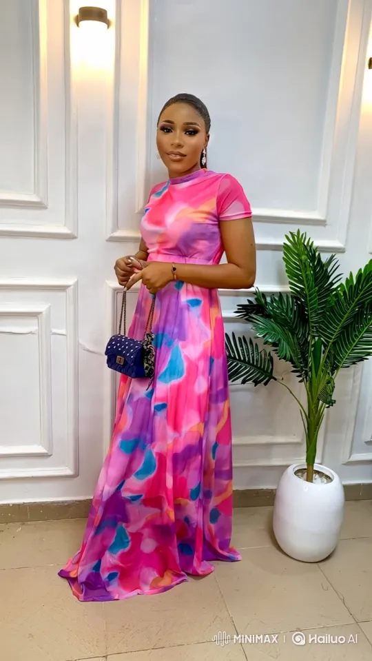 Elegant Woman in Vibrant Maxi Dress with Graceful Pose – AI Generated Video | Hailuo AI
