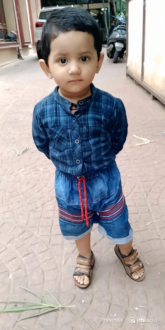 Young Boy's Gentle Smile Emerges on Walkway – AI Generated Video | Hailuo AI