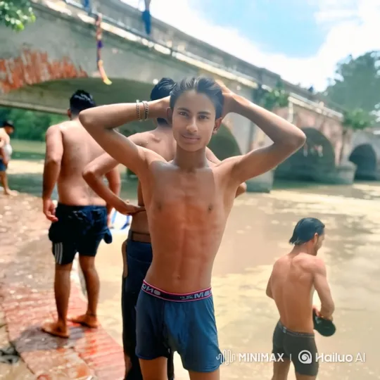 Young Man Poses by Murky River on Sunny Day – AI Generated Video | Hailuo AI