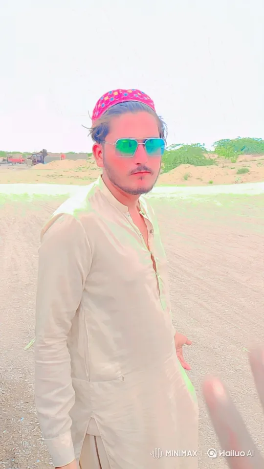 Young Man in Desert Landscape with Gentle Breeze – AI Generated Video | Hailuo AI