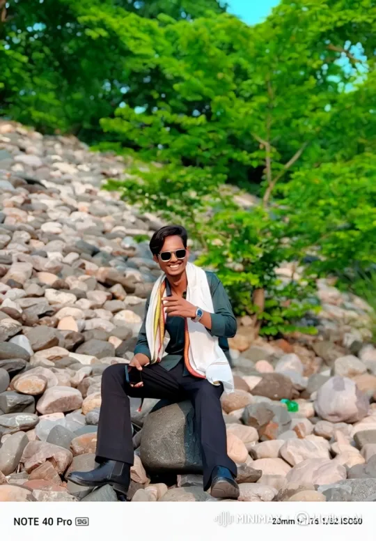 Young Man Relaxing on Hillside with Gentle Breeze – AI Generated Video | Hailuo AI