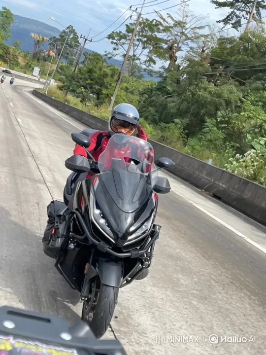 Motorcyclist Tours Scenic Mountain Road – AI Generated Video | Hailuo AI