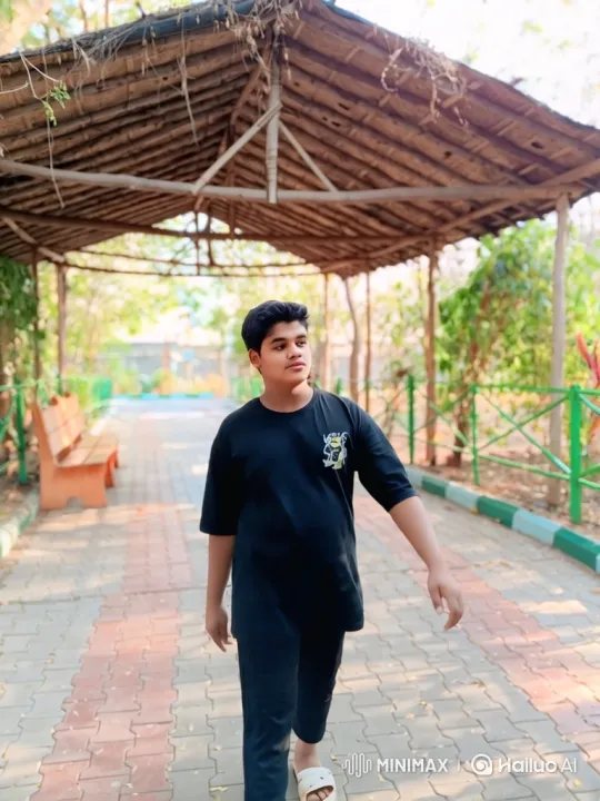 Young Man Contemplates as He Strolls Through Park – AI Generated Video | Hailuo AI