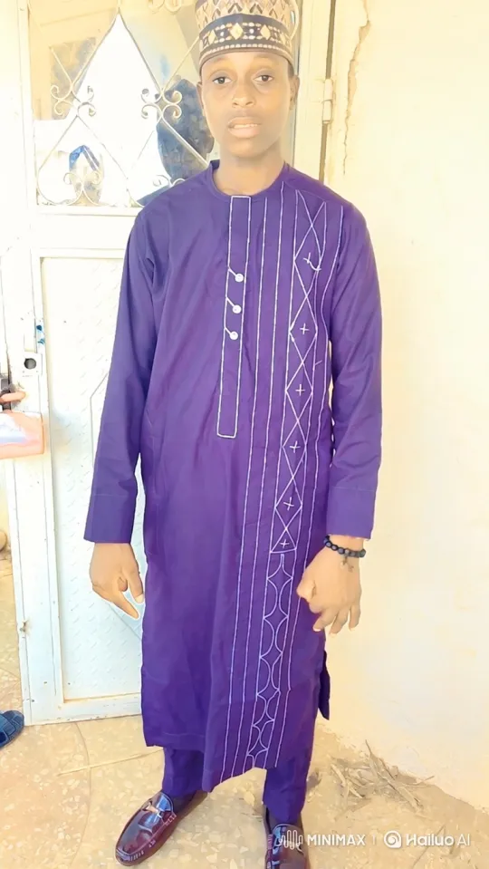 Young Man in Elegant Purple Attire with Gentle Smile – AI Generated Video | Hailuo AI