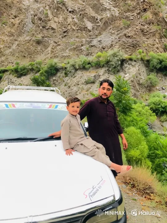 Man and Boy Enjoy Mountain View with Serene Bonding Moment – AI Generated Video | Hailuo AI