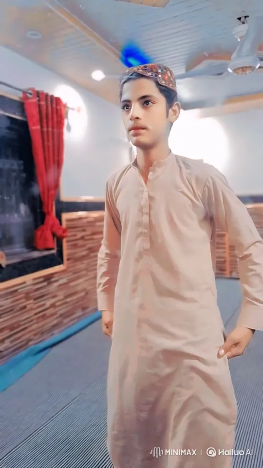Young Man Contemplates in a Quietly Lit Room – AI Generated Video | Hailuo AI
