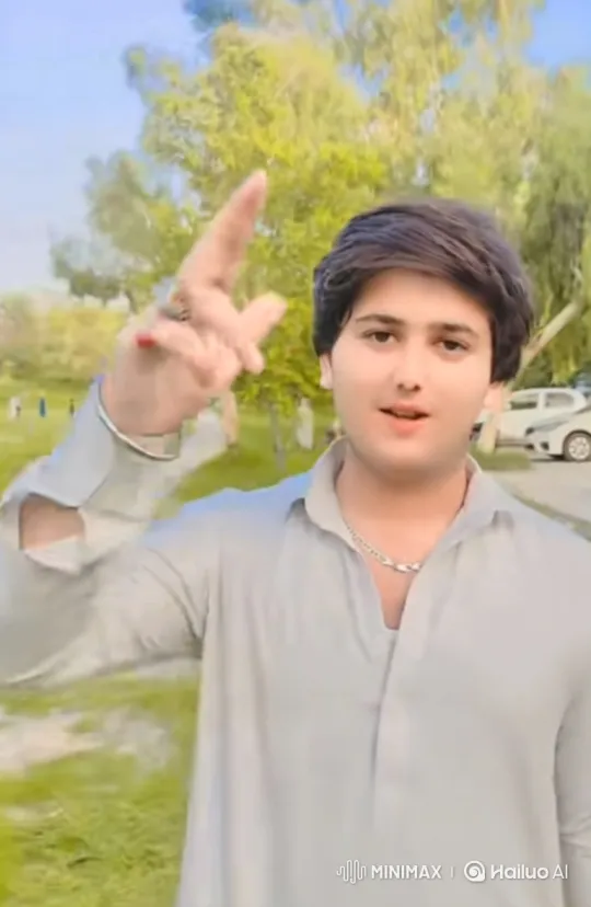 Young Man in Park with Hand Gesture – AI Generated Video | Hailuo AI