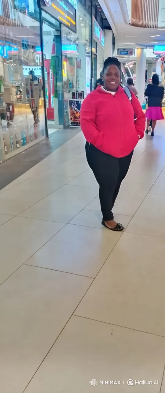 Woman Gracefully Ascends in Shopping Mall Corridor – AI Generated Video | Hailuo AI