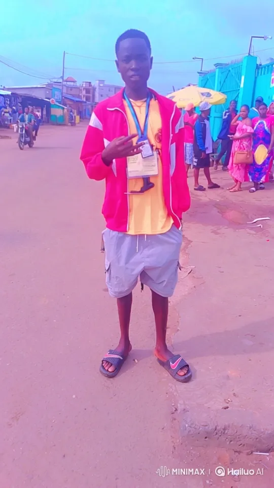 Young Black Man in Pink Jacket Walks with Tracking Shot – AI Generated Video | Hailuo AI