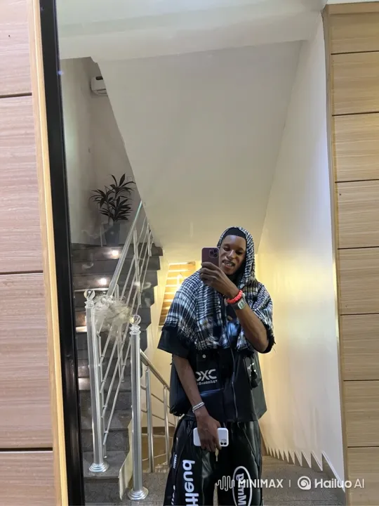 Young Man Takes Selfie, Shifts to Neutral Stance – AI Generated Video | Hailuo AI