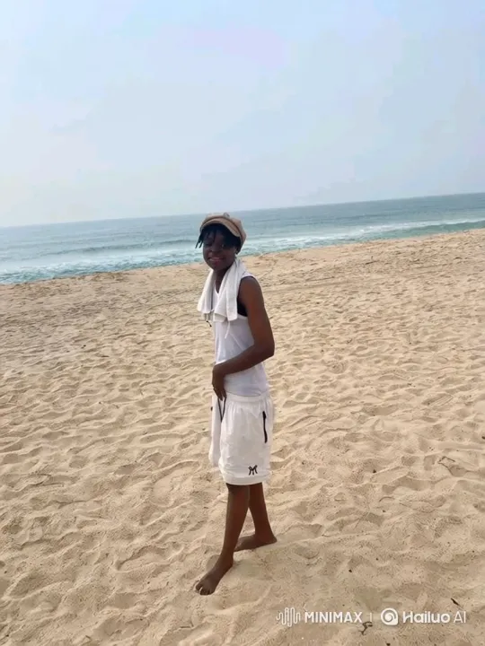 Young Person Reflects on a Sandy Beach in Slow Motion – AI Generated Video | Hailuo AI