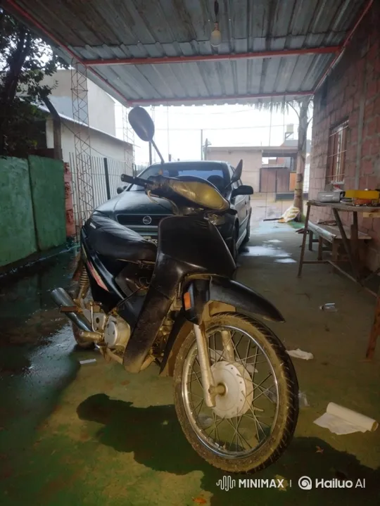 Motorcycle Self-Uprights on Wet Driveway – AI Generated Video | Hailuo AI
