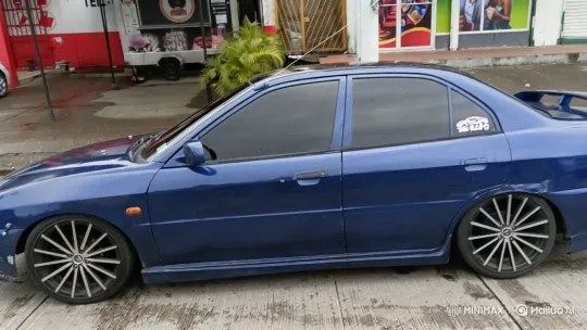 Custom Blue Sedan Showcases Aggressive Body Kit and Air Suspension – AI Generated Video | Hailuo AI