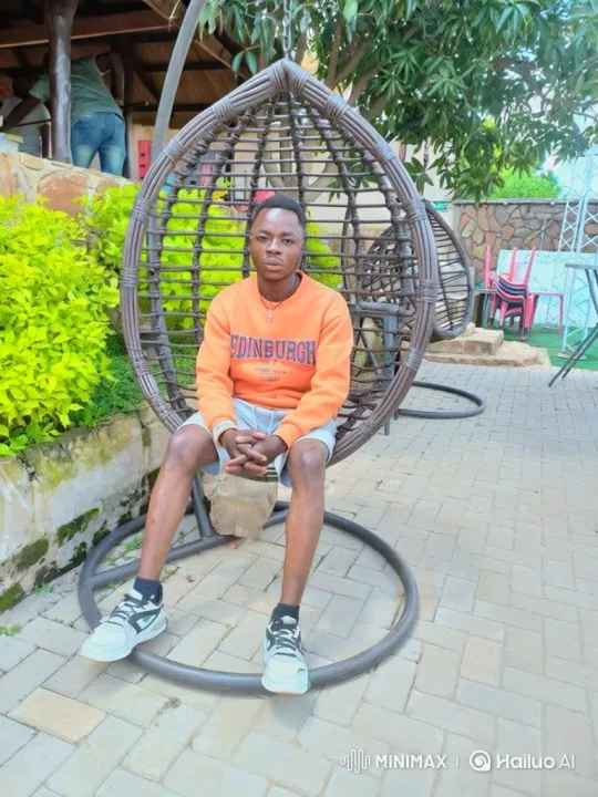 Young Man in Egg Chair Observes Sky and Car – AI Generated Video | Hailuo AI
