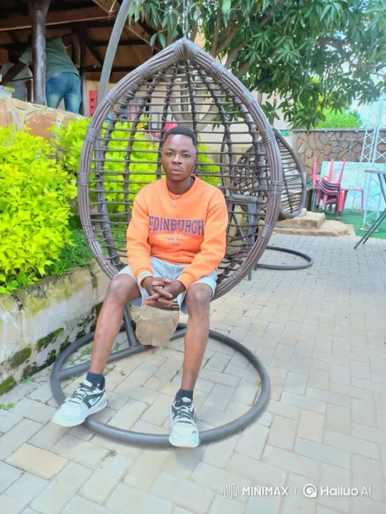 Young Man in Hanging Chair Amidst Nature – AI Generated Video | Hailuo AI