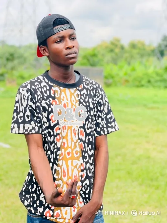 Young Man in Field Shows Defiance with Gesture – AI Generated Video | Hailuo AI